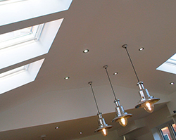 Stylish lighting sat between skylights that allow natural light.